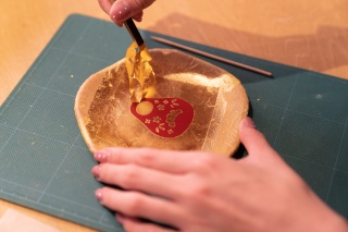 Gold leaf application - a must-try when you come to Kanazawa!