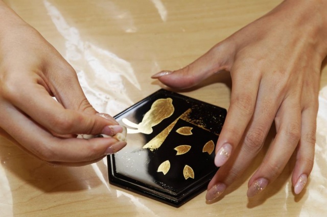 Removing excess gold leaf