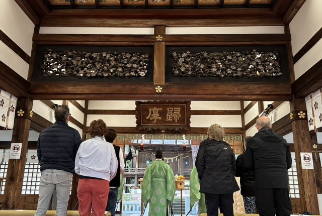 presentation of Tamagushi, a sacred sprig of evergreen Sakaki by chief priest